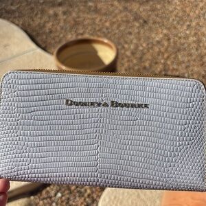 Dooney & Bourke Lizard embossed Large Zip Around Wristlet in Lilac.